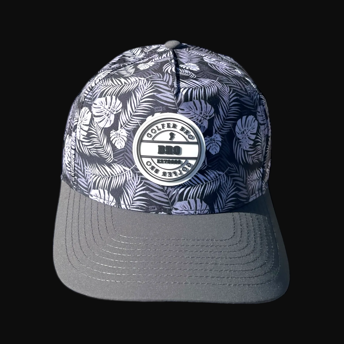 Cap with floral pattern and brand logo on a black background