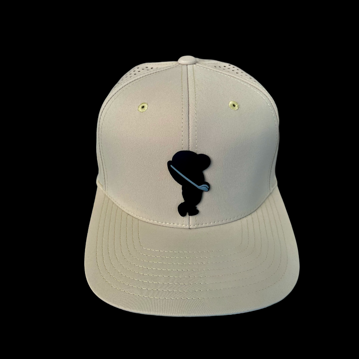 GolferBro performance cap in beige with a black golfer silhouette patch, featuring a lightweight, quick-dry design.